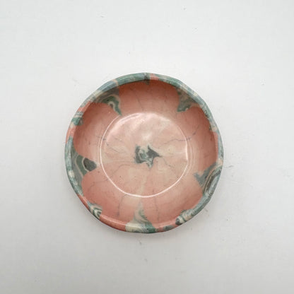 Handmade Sakura Nerikomi porcelain dipping bowl and jewelry holder with a pink and white marbled pattern, measuring 2 inches in diameter.