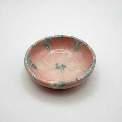 Handmade Sakura Nerikomi porcelain dipping bowl and jewelry holder with a pink and white marbled pattern, measuring 2 inches in diameter.