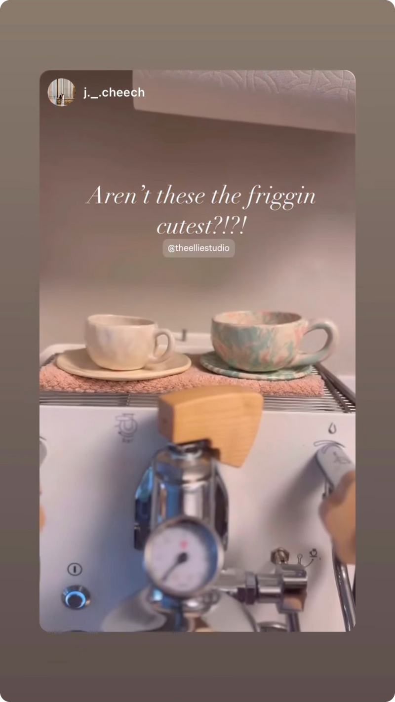 pastel espresso latte coffee mug sauver set. creamy white pink green on top of a white espresso machine.