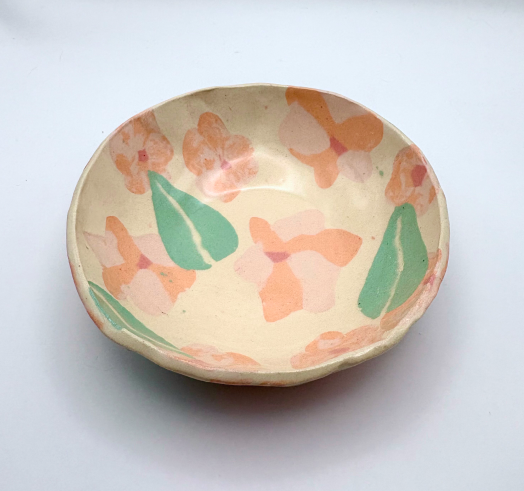 Handmade patterned ceramic plates created by students in a Nerikomi workshop. Cute flower leave pattern