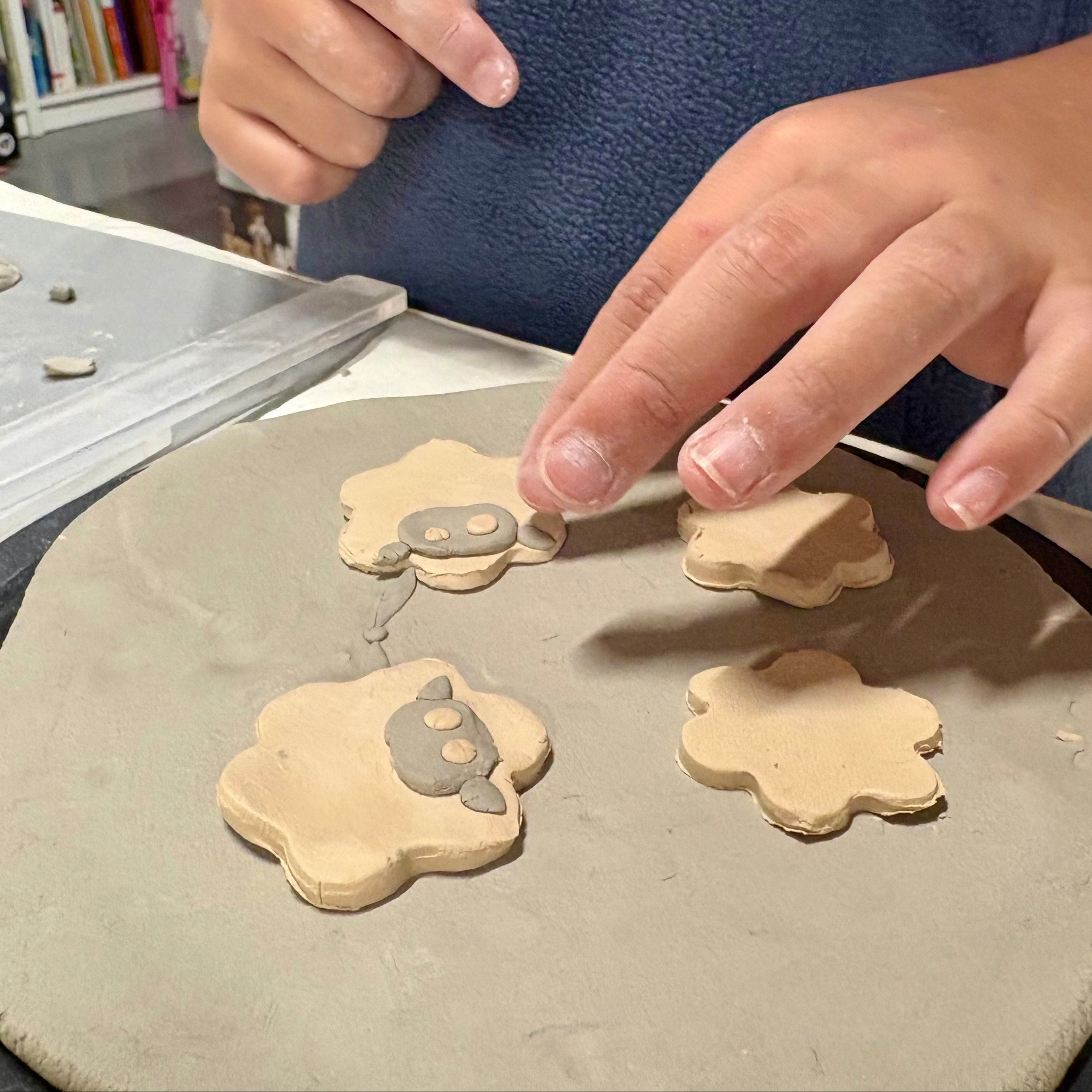 Person working with clay on in a home setting